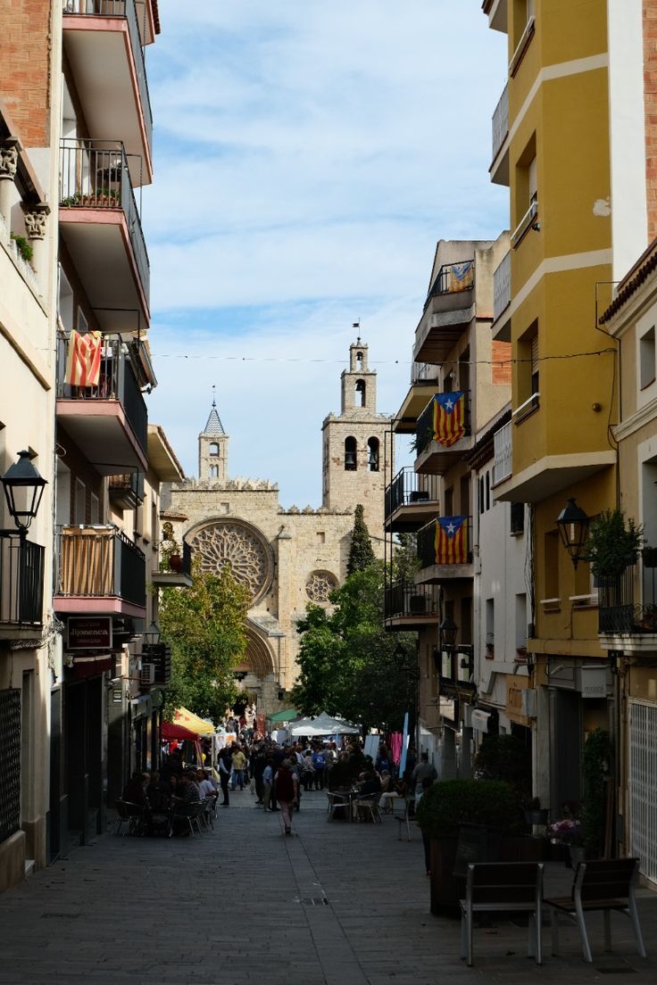 A pedestrian street in Sant Cugat's old town leading to the monastery